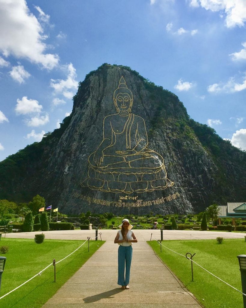 Buddha buddha image engraved on the side of Khao Chi Chan mountain and ...